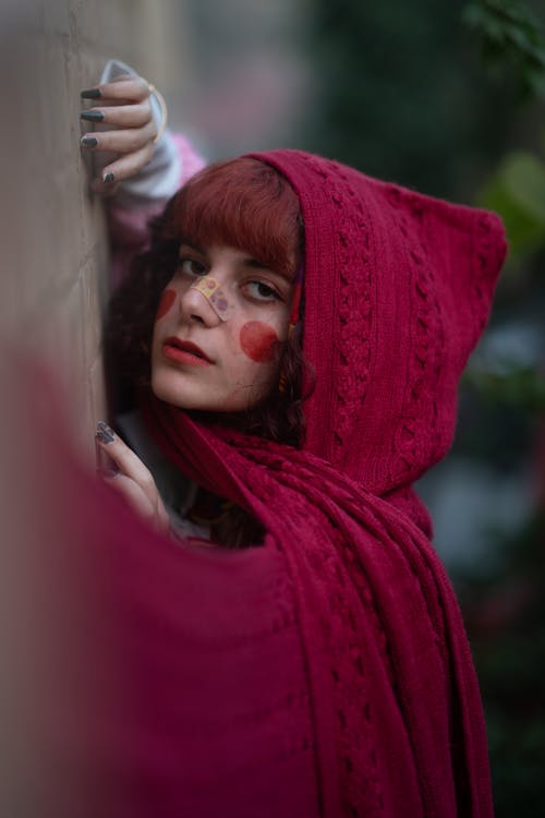 Close-up Photo of Woman wearing Red Cloak 