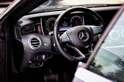 Free Elegant Mercedes-Benz interior featuring sleek design and advanced dashboard. Stock Photo