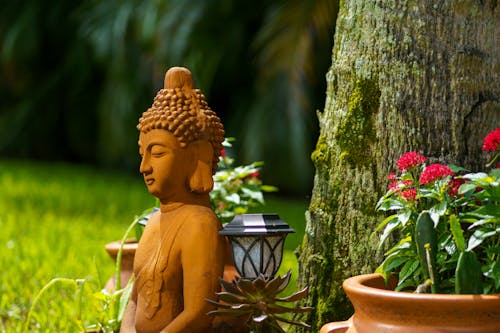 Free Brown Ceramic Buddha Figurine Stock Photo