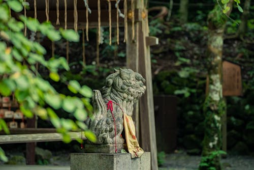 Traditional Stone Statue in Japanese Summer Forest