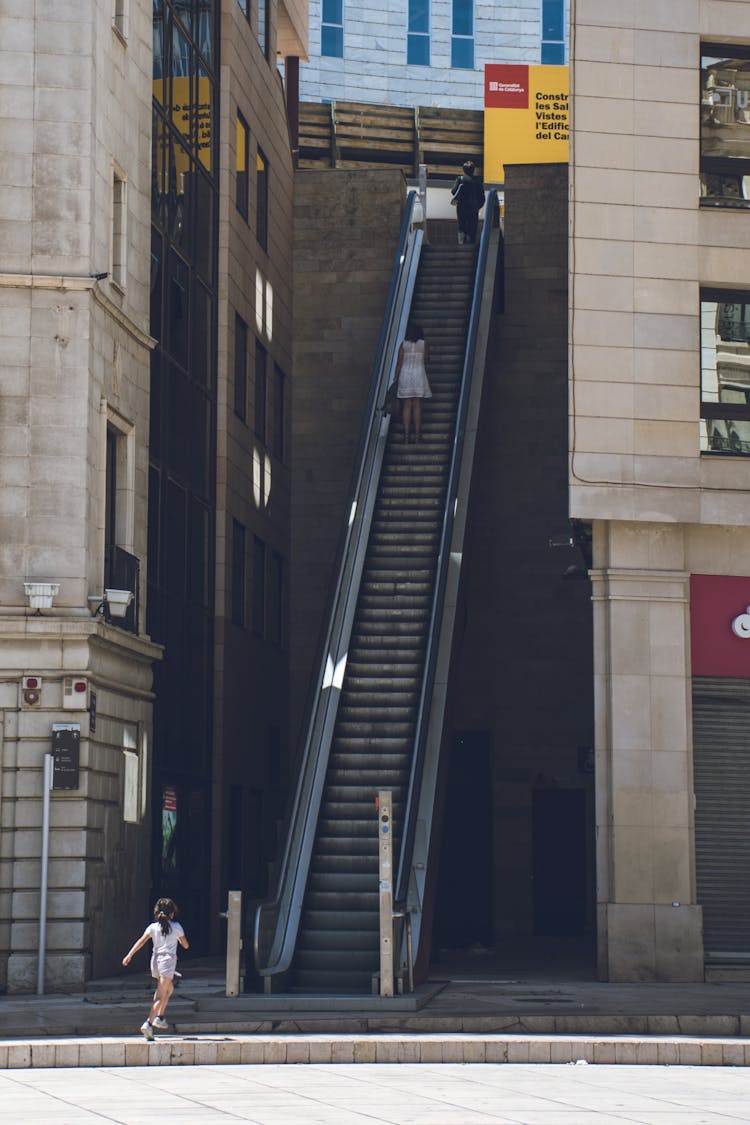 Girl Walking Towards The Escalator