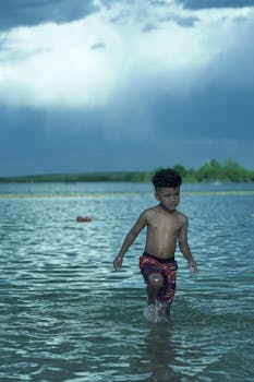 A young boy enjoys a summer day swimming at a lake in Aurora, Colorado.