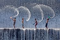 Boys Playing on the Spillway