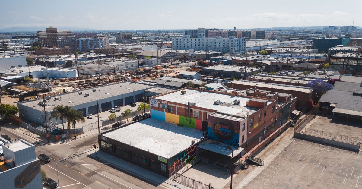 A vibrant aerial shot capturing urban Los Angeles with colorful buildings and clear skies.