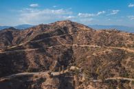 Roads On Mountain With Desert Shrubs