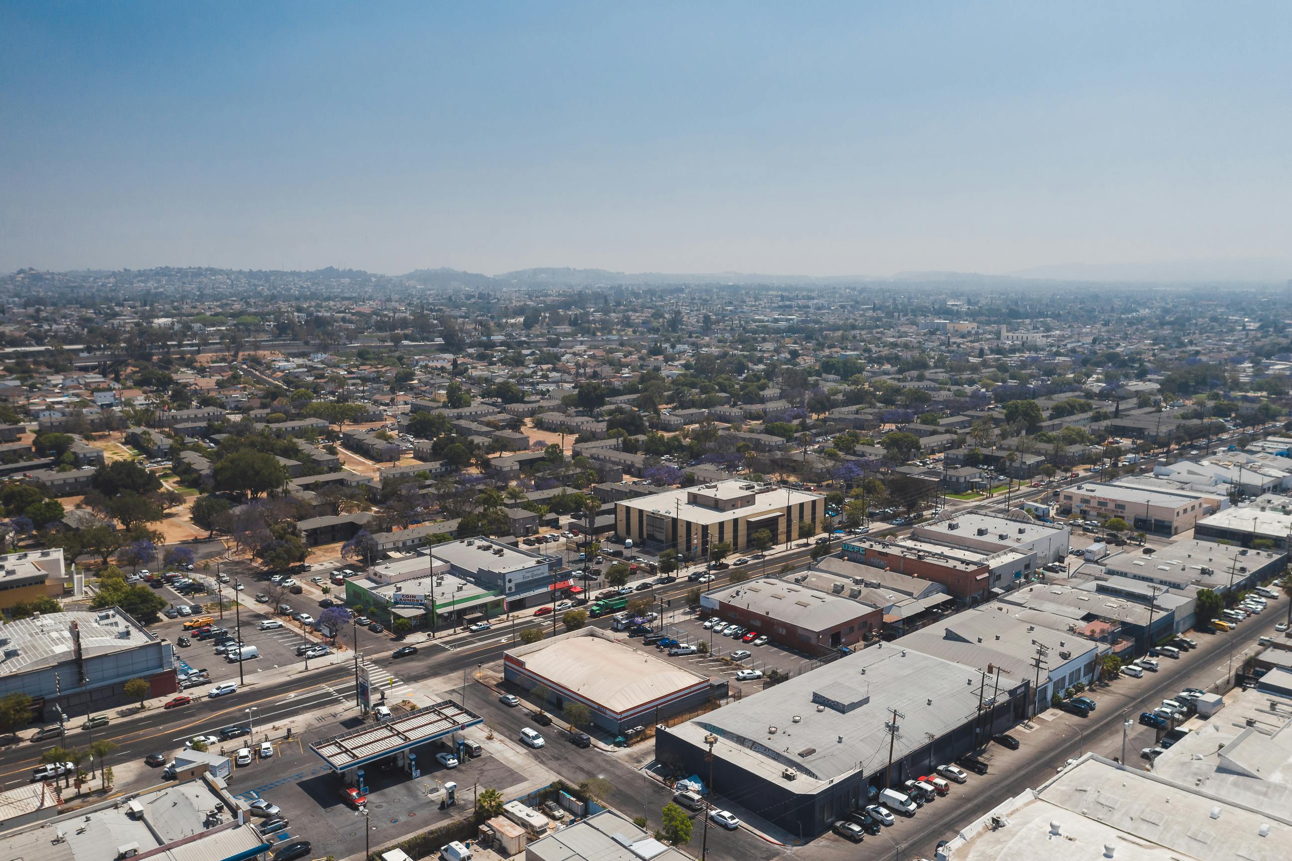 Drone shot capturing a wide view of a sunny urban area in Los Angeles, USA.