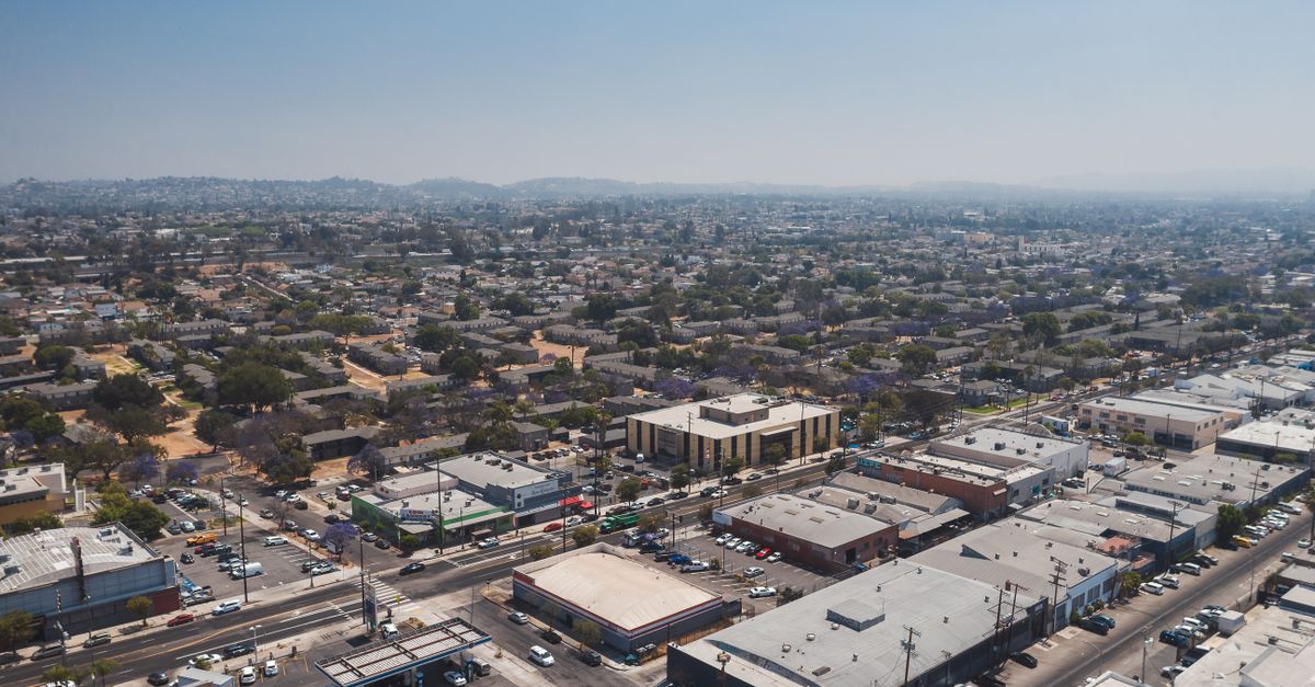 Drone shot capturing a wide view of a sunny urban area in Los Angeles, USA.