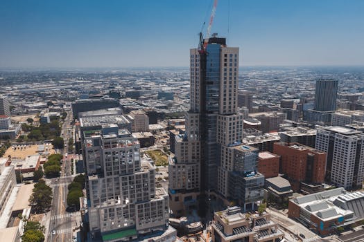 Vibrant aerial photo showcasing modern high-rise construction in Los Angeles cityscape.