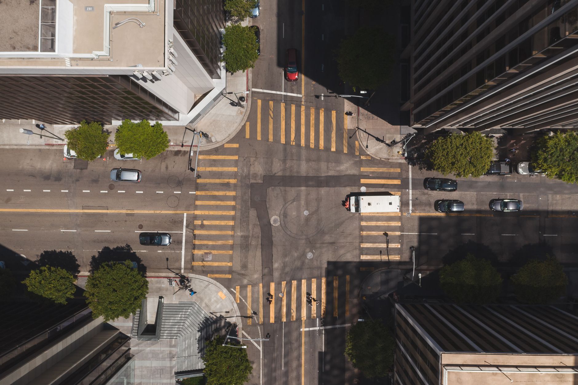 Overhead shot of a bustling crossroad in downtown Los Angeles, California.