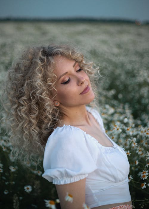 Close-Up Shot of a Curly-Haired Woman 