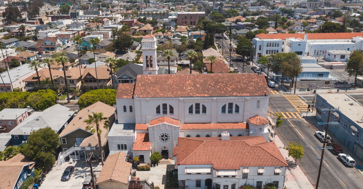 A picturesque aerial view showcasing a church amidst an urban cityscape in Los Angeles, California.