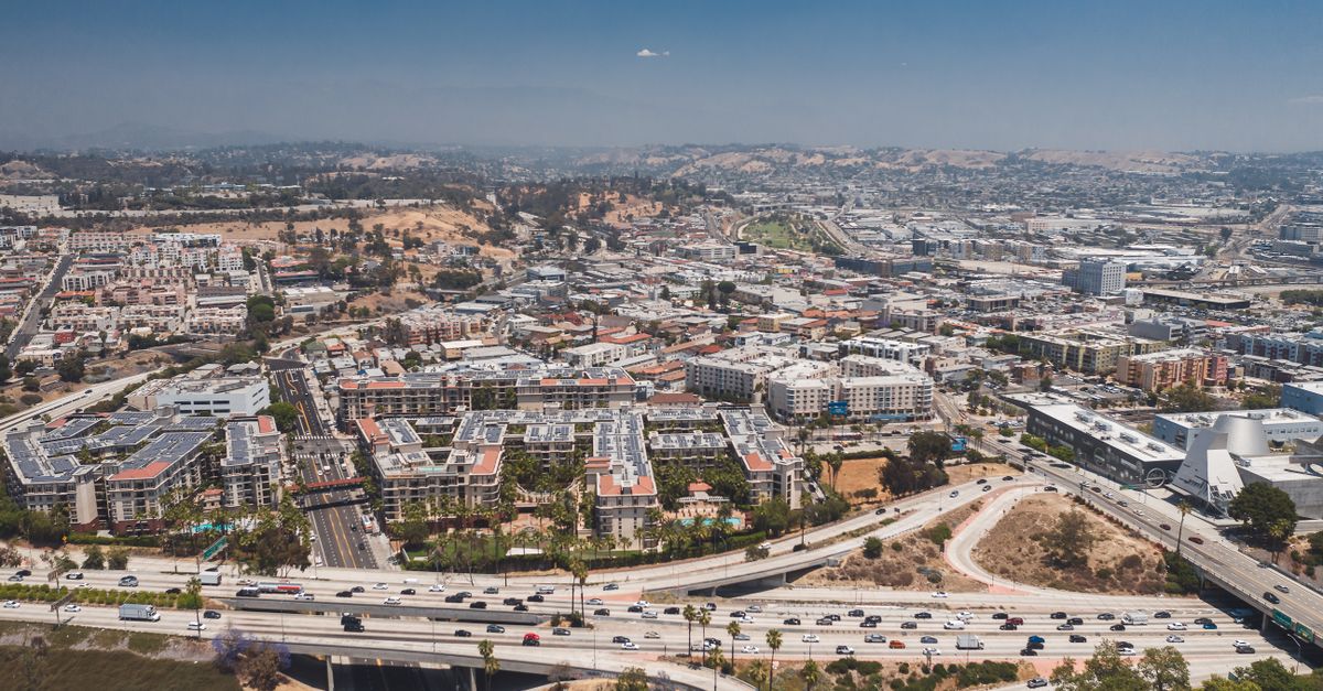 Explore the sprawling cityscape of Los Angeles from above, showcasing urban life.