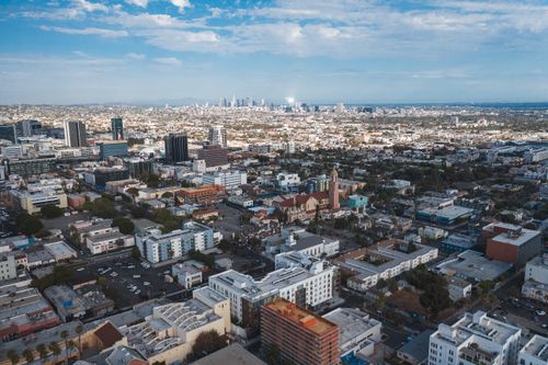 Free Stunning aerial photograph showcasing a sprawling cityscape under a clear blue sky. Stock Photo