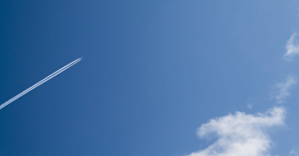 Jet Under Clear Blue Sky during Daytime