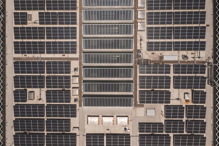 Solar panels covering a large commercial rooftop