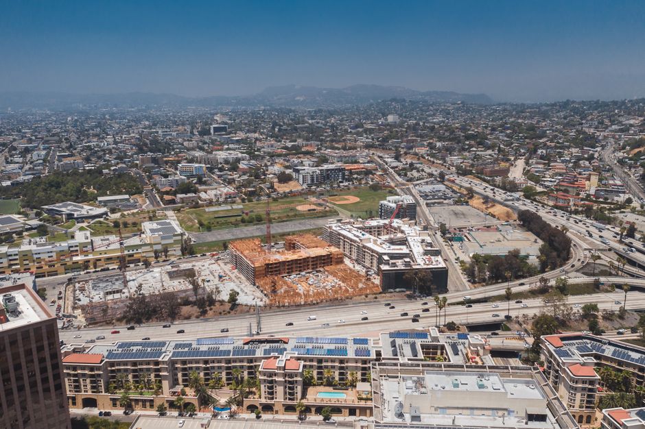 Spectacular Private Helicopter Tour over Long Beach: See Catalina, Queen Mary Review Review 2026 - Aerial view showcasing the urban sprawl of Los Angeles with construction sites and highways visible.