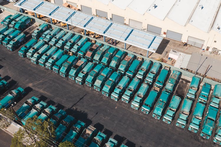 Blue Trucks Parked On Parking Lot