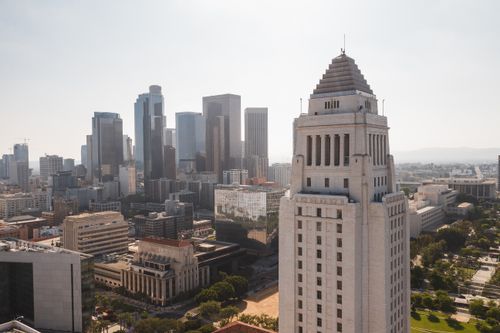 Free Aerial view of Los Angeles City Hall with the city skyline in the background. Stock Photo