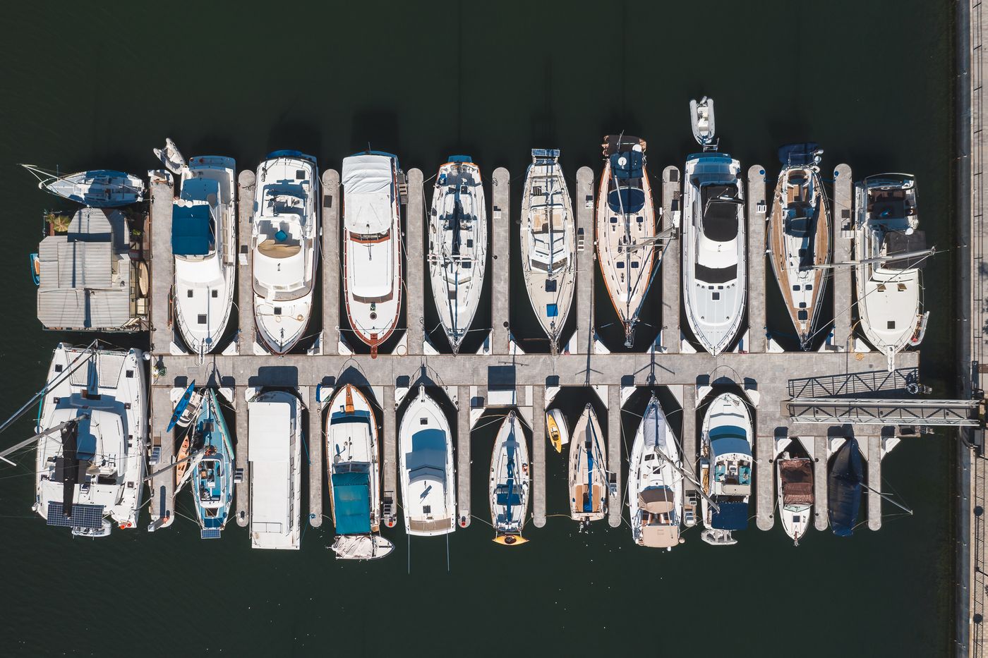 Aerial view of vessels at a marina for tailored marine care