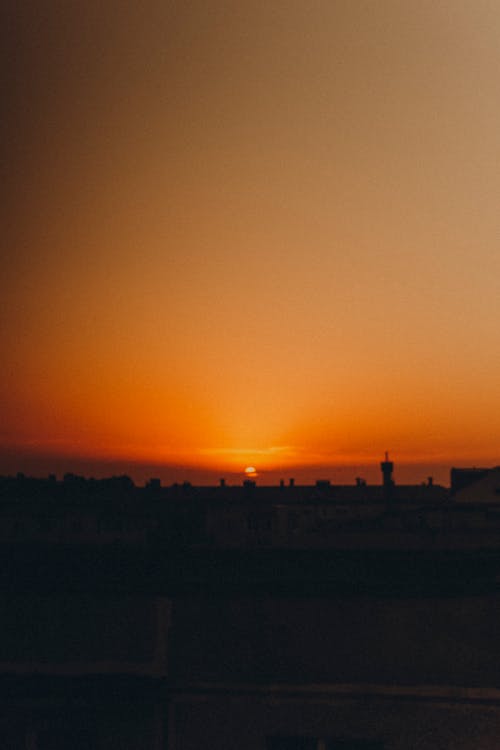 Silhouette of City Buildings During Sunset