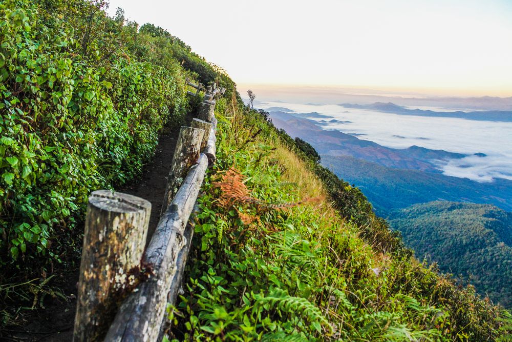 A log fence running along a mountain ridge