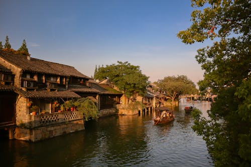 Clear Sky over River in Village