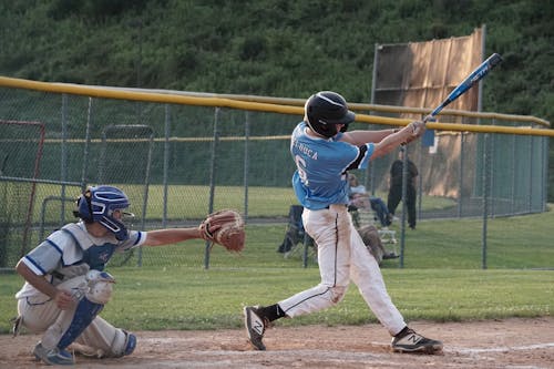 Free Man Swinging a Baseball Bat Stock Photo