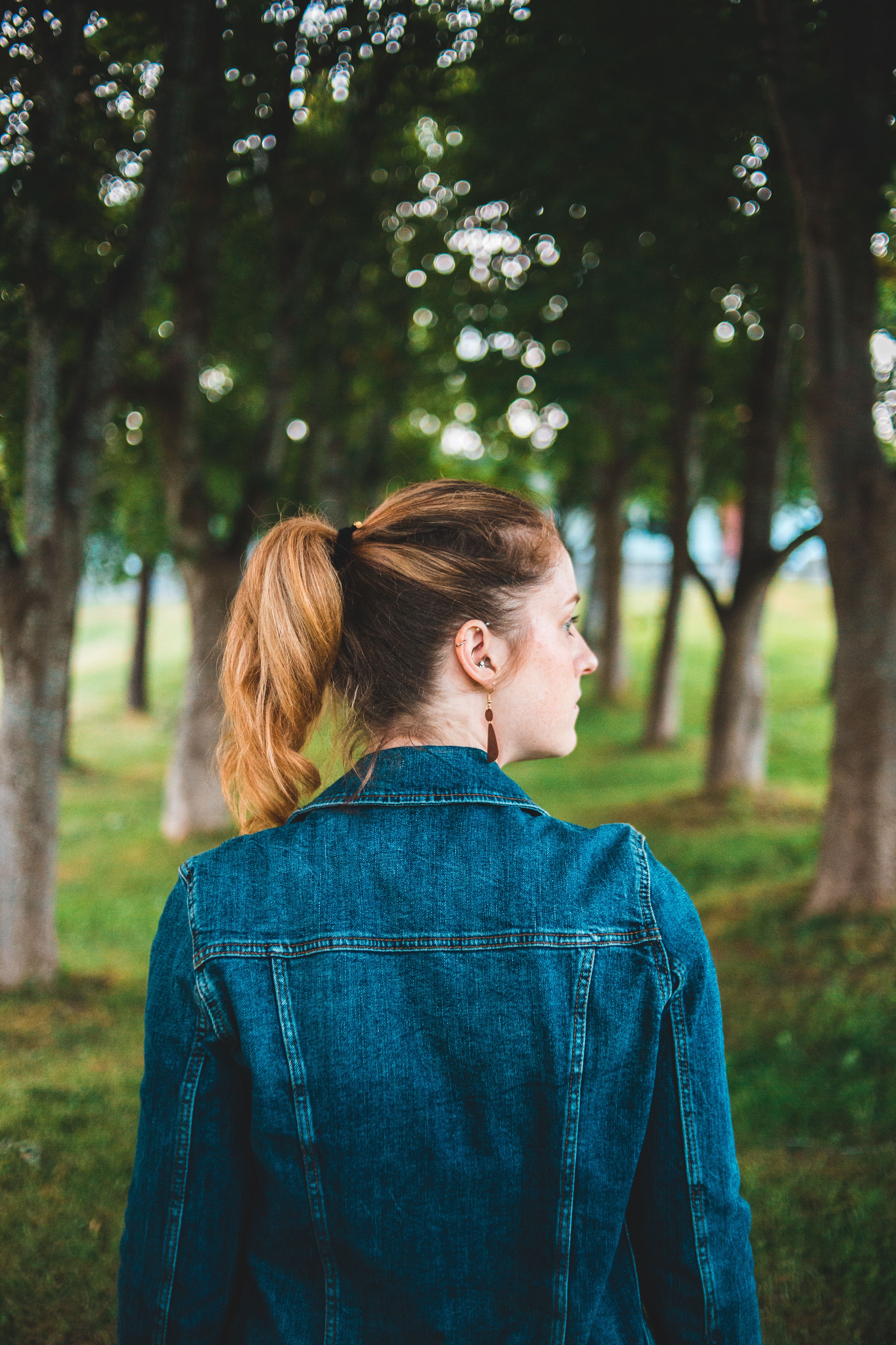 Back View of a Woman wearing a Denim Jacket · Free Stock Photo