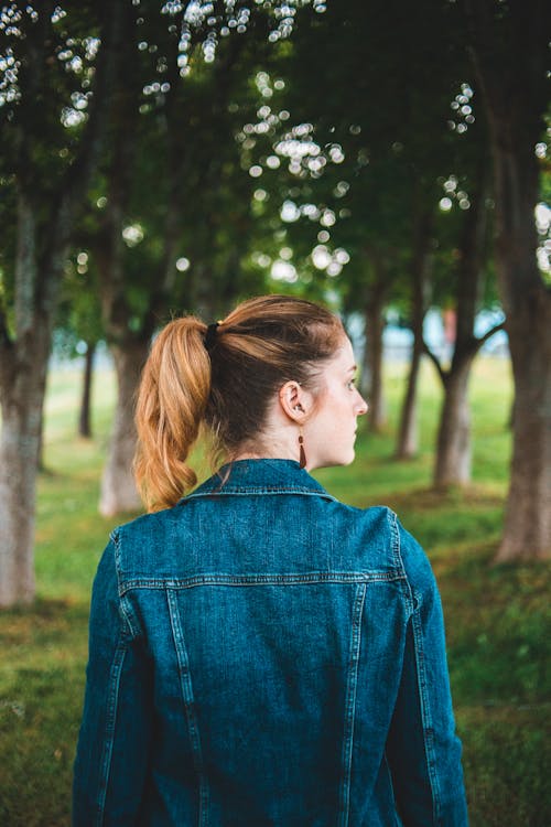 Back View of a Woman wearing a Denim Jacket