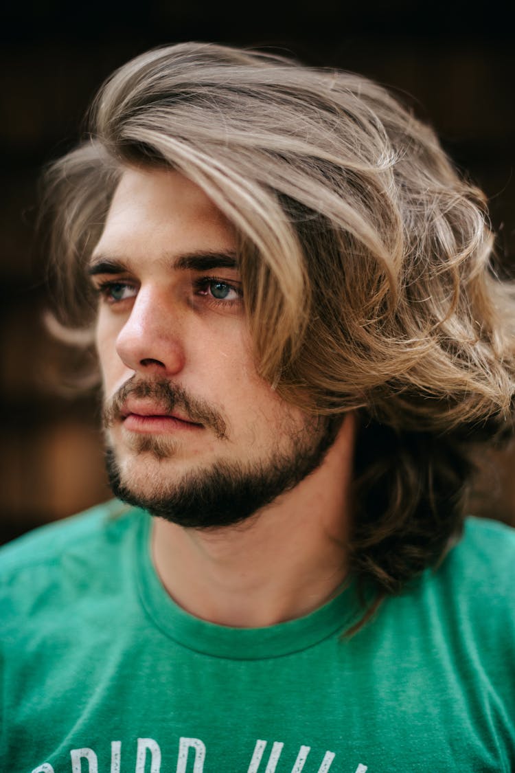 Man With Wavy Hair And Green T-Shirt