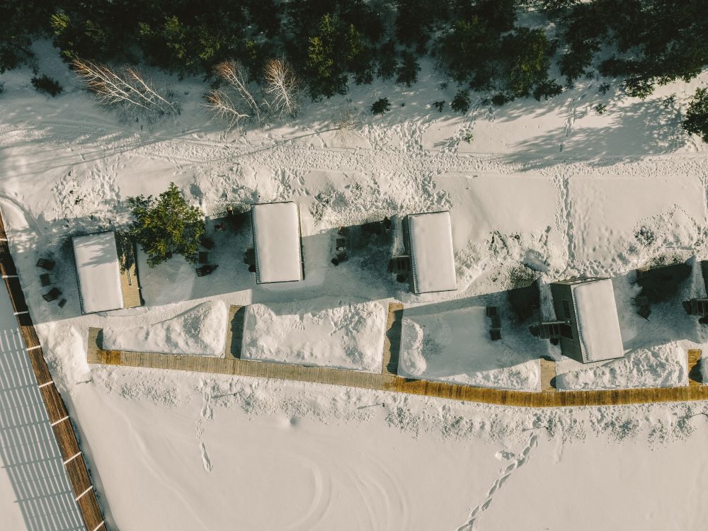 Aerial Shot of Buildings Covered in Snow · Free Stock Photo