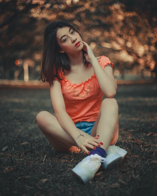 Photo of Woman sitting on the Grass