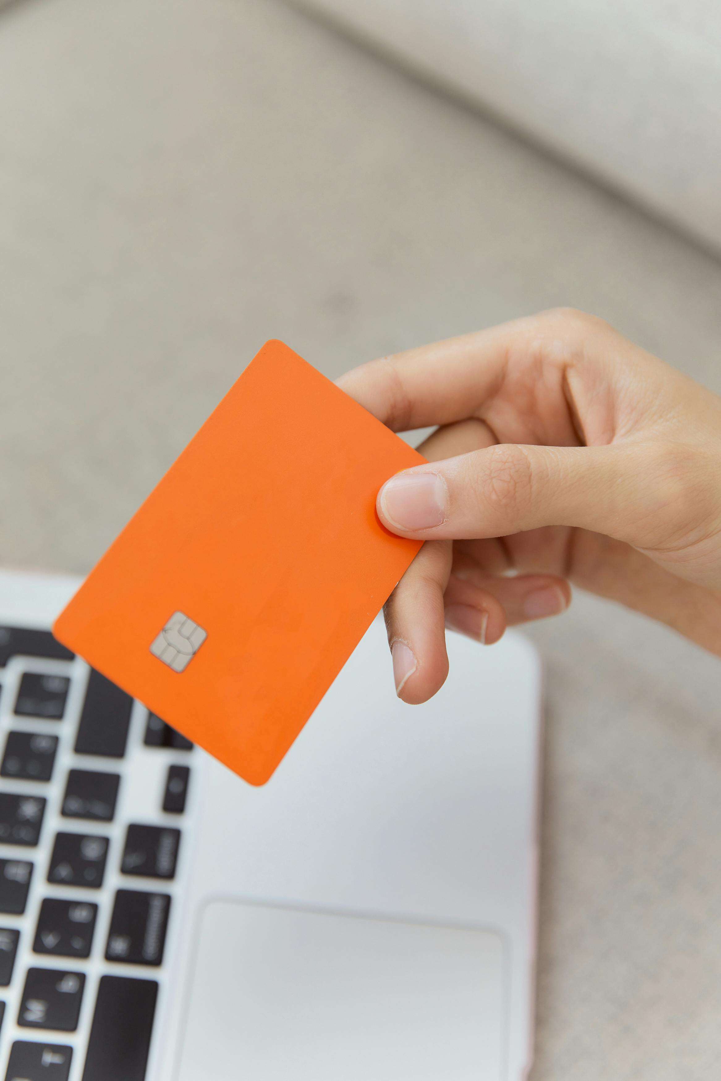 close up of a orange bank card