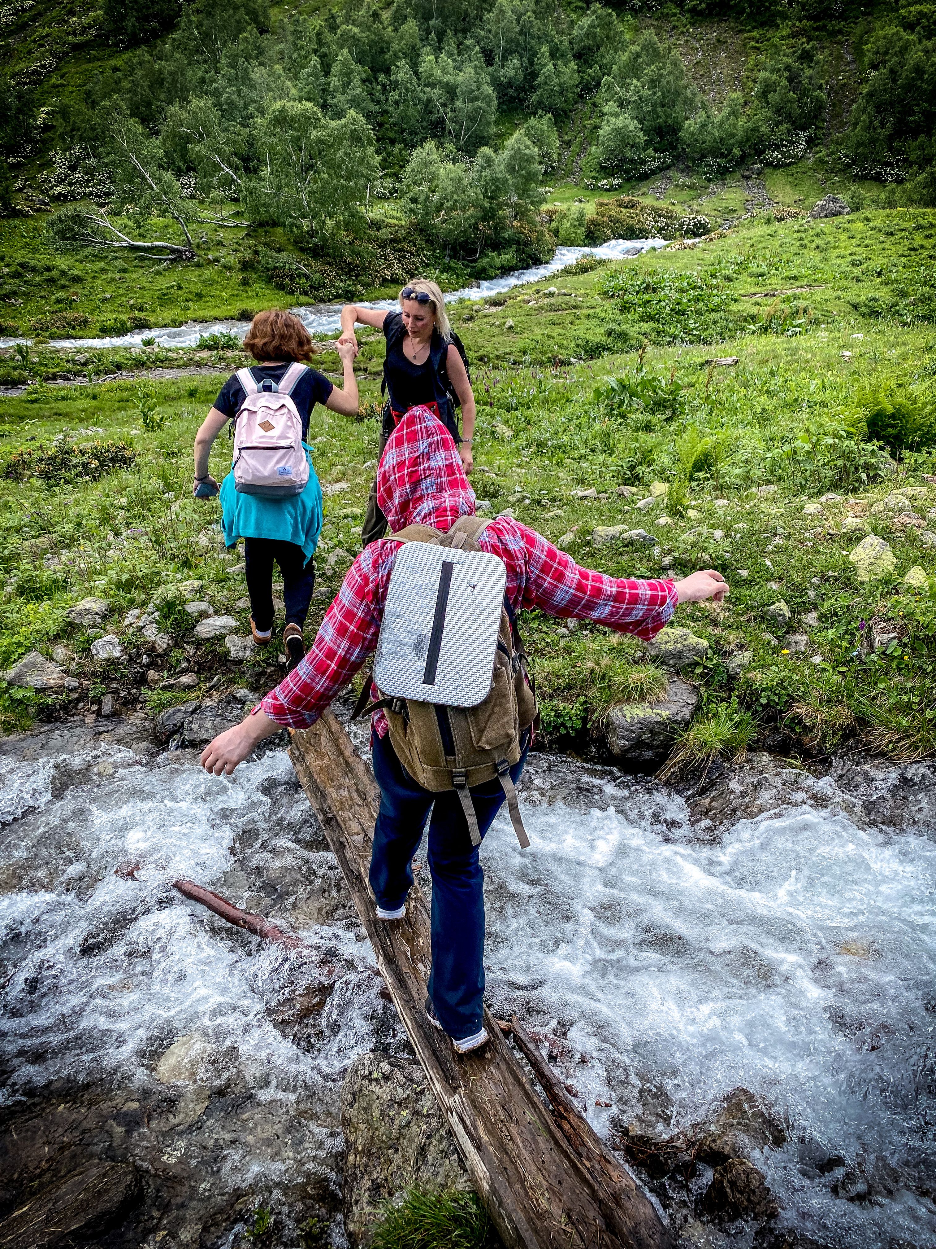 People Crossing River on Hiking Adventure · Free Stock Photo