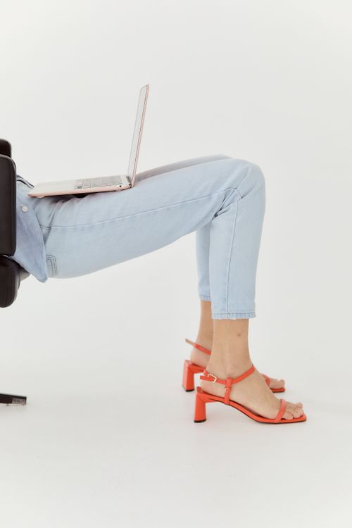 Woman in cropped jeans with kitten heels