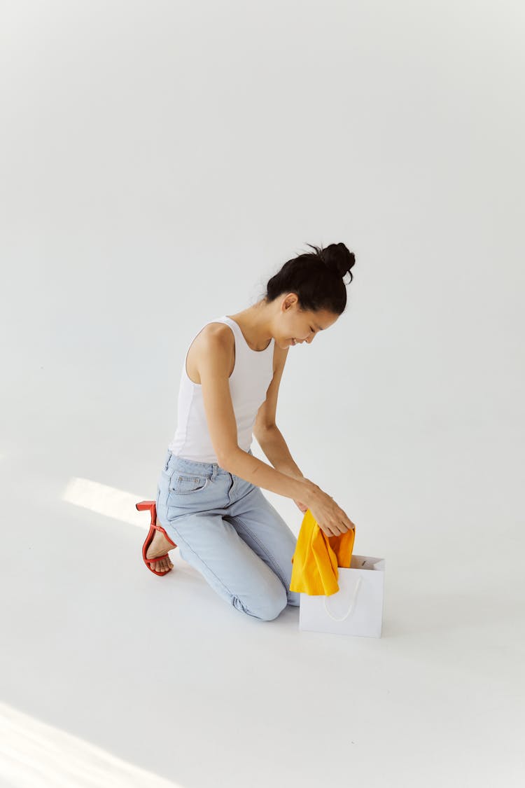 A Woman Checking Her Online Shopping Delivery