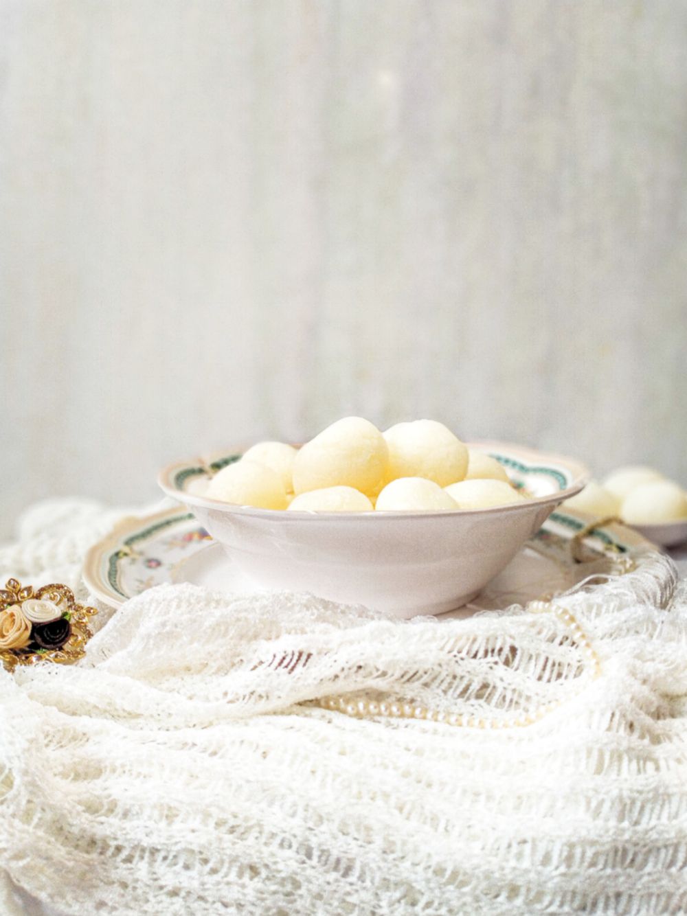Soft spongy rasgulla in sugar syrup
