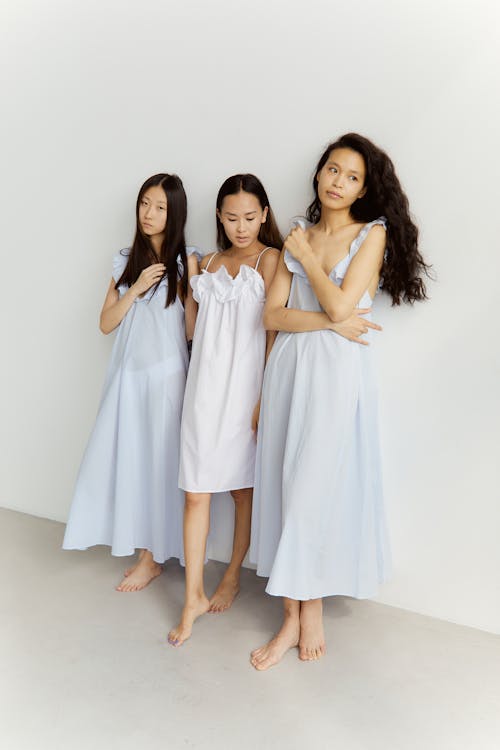 Women Posing Wearing Delicate Dresses