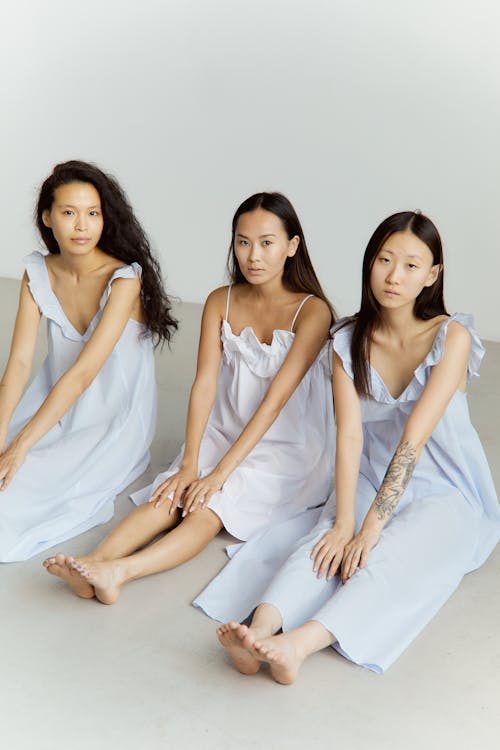 Women Posing Wearing Delicate Dresses