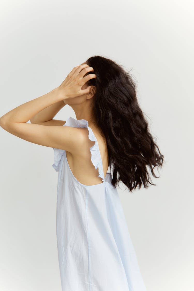 Close-Up Shot Of A Woman Holding Her Hair