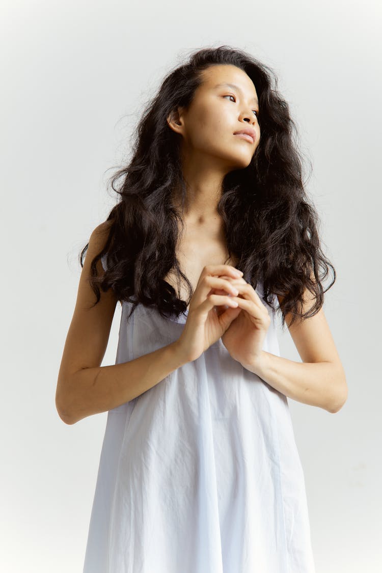 Close-Up Shot Of A Woman Wearing A Sleeveless Dress