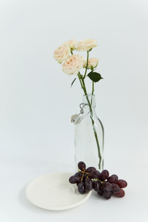Grapes beside a Flower Vase