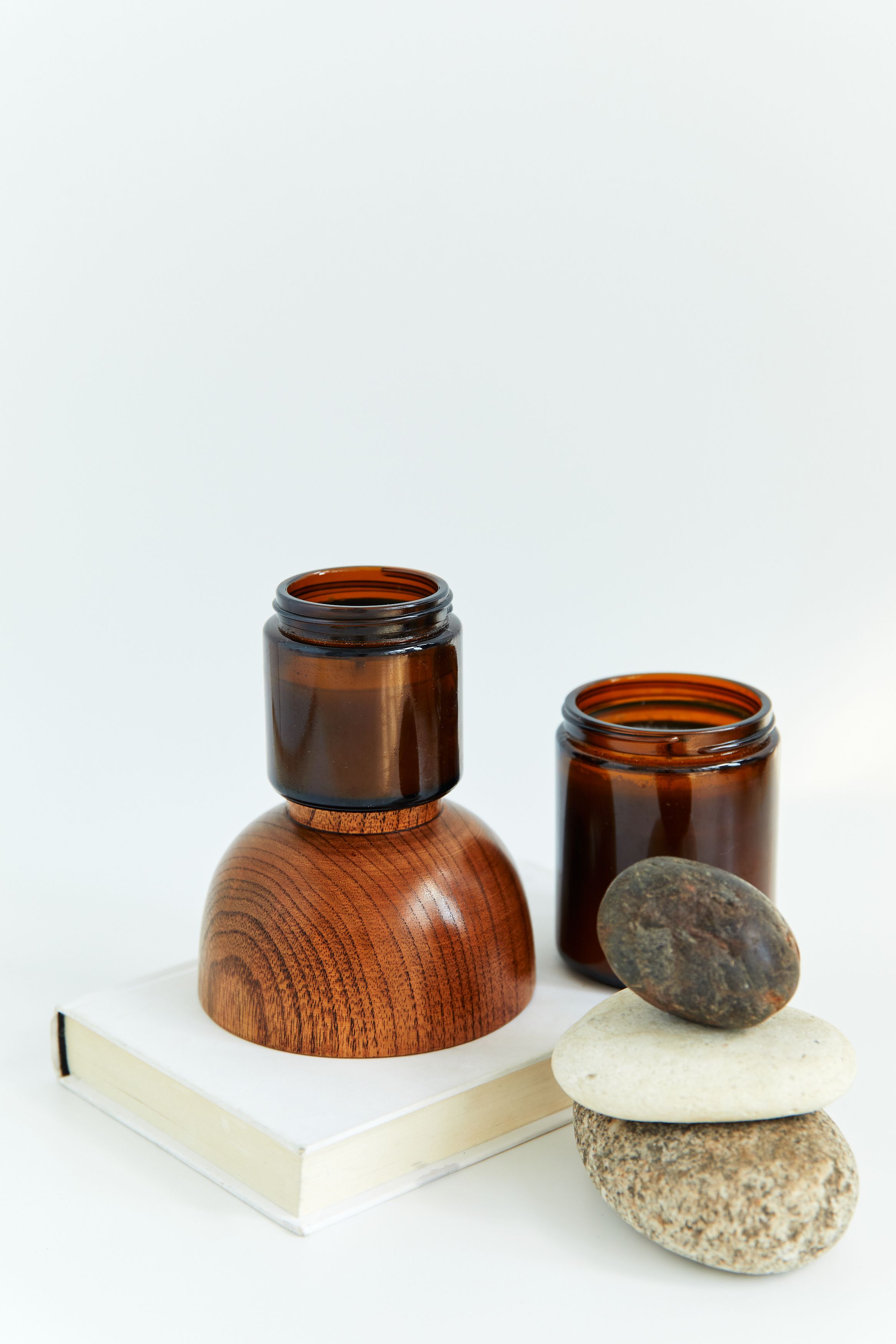 Minimal glass jars with smooth stones, a calm low light terrarium style arrangement