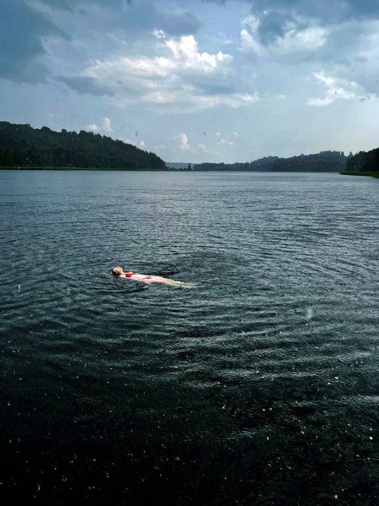 Woman Floating On The Water 