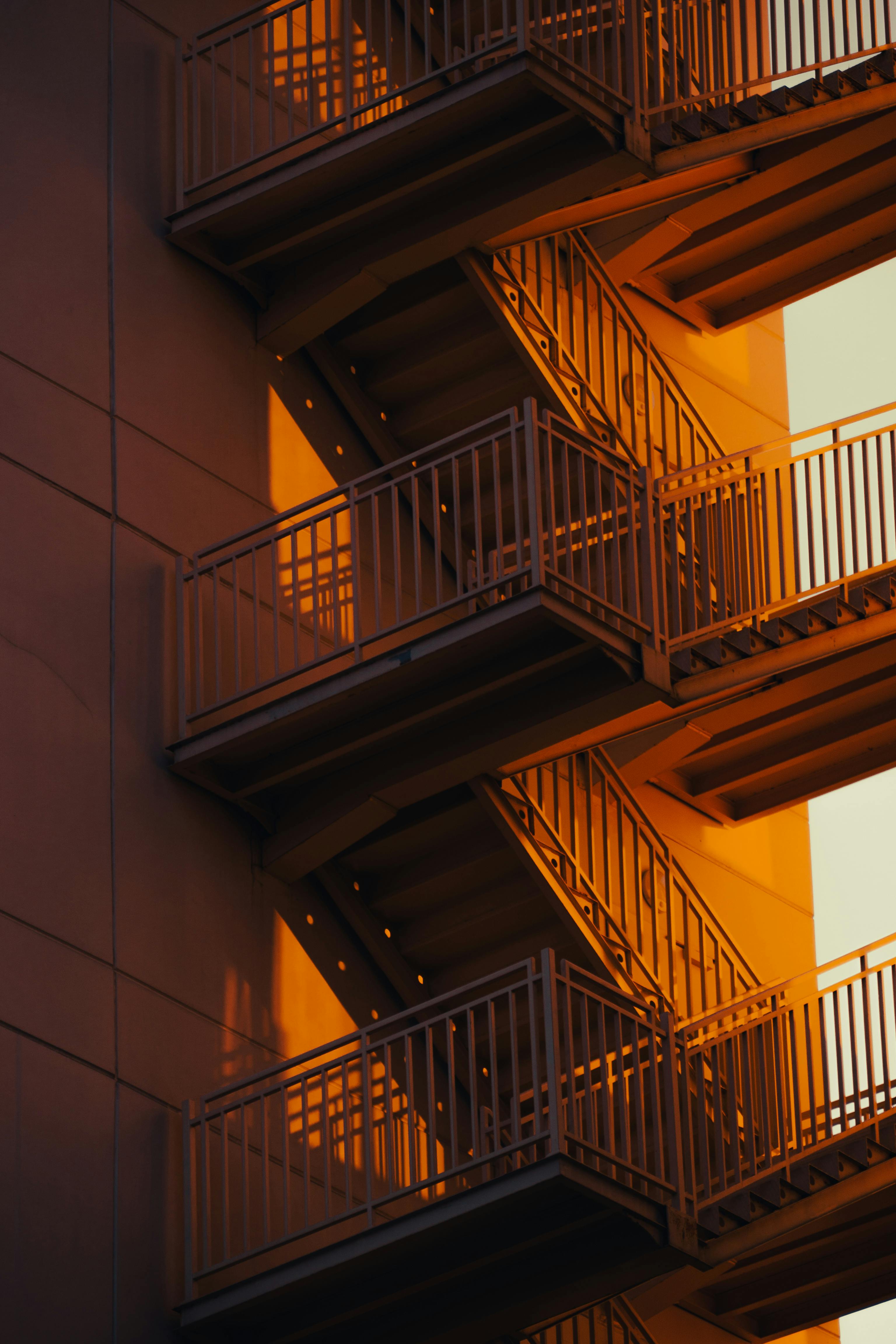 A warm capture of an outdoor fire escape staircase in Istanbul during golden hour.