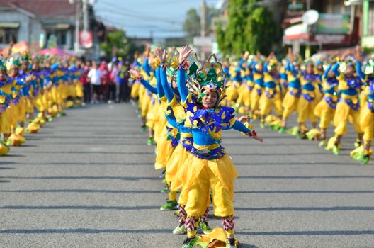 A colorful street dance performance showcasing traditional Filipino attire and lively choreography in Iba, Philippines.