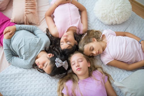 Free Overhead Shot of a Group of Friends Sleeping Stock Photo