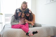 2 Women Sitting on Couch