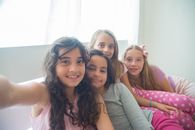 3 Women Sitting on Couch