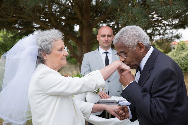 Man Kissing A Woman On Her Hand